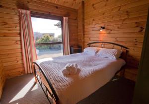 Postel nebo postele na pokoji v ubytování Hall's Cabin - Lake Tekapo