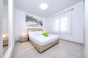 Posteľ alebo postele v izbe v ubytovaní Monarca House, Senator