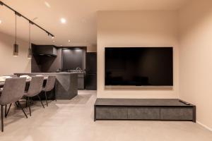 TV a/nebo společenská místnost v ubytování Tokyo Waseda Base