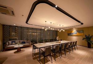 a dining room with a large table and chairs at The Sóng Căn Hộ nằm cạnh Biển -An's Homestay in Vung Tau +97 photos