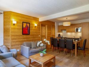 a living room with a couch and a table at Snowy Escape in Scenic Vallorcine in Vallorcine