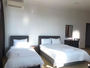 Postel nebo postele na pokoji v ubytování Glistar Hotel