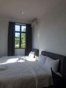 Postel nebo postele na pokoji v ubytování Glistar Hotel