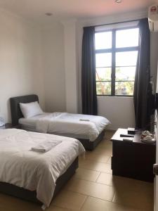 Postel nebo postele na pokoji v ubytování Glistar Hotel