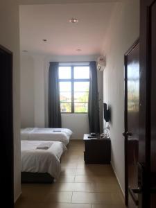 Postel nebo postele na pokoji v ubytování Glistar Hotel