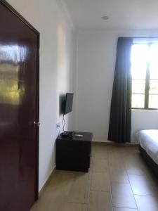 Postel nebo postele na pokoji v ubytování Glistar Hotel