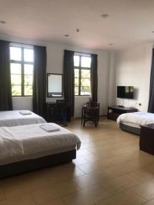 Postel nebo postele na pokoji v ubytování Glistar Hotel