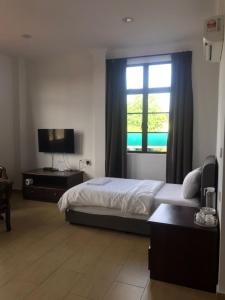 Postel nebo postele na pokoji v ubytování Glistar Hotel