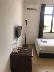 Postel nebo postele na pokoji v ubytování Glistar Hotel