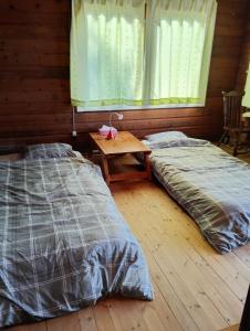 The Little Cabin in Shodoshima -小豆島 山小屋 リトルキャビン-客房内的一张或多张床位