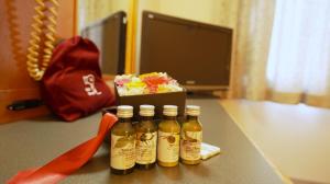 a group of four bottles of beer on a table at 美祢グランドホテル in Mine