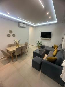 a living room with a couch and a table at luxury apartament mirador del golf 3 in Cabo Negro +102 photos