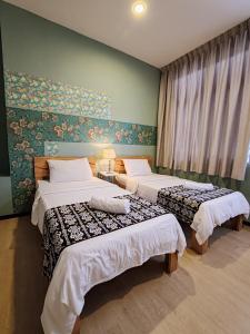 Postel nebo postele na pokoji v ubytování Treeline Urban Inn + 23 fotografií