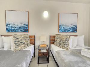 Postel nebo postele na pokoji v ubytování Nautilus by La Jamaca Hotels-Downtown La Parguera