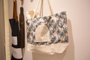 a tote bag is hanging on a wall at CASCO 114, king bed Stylish and Cozy apartment near Casco in Panama City +30 photos