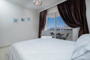 Una cama o camas en una habitación de Cosy appartement moderne hypercentral and calm