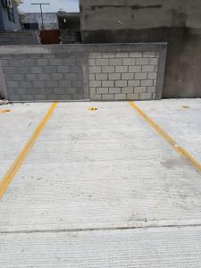 an empty parking lot with yellow lines on it at Departamento "Mar & Descanso" in Ciudad Madero +2 photos