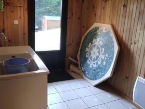 a kitchen with a sink and a plate in the corner at Chalet authentique au cœur de la nature près de Super Besse - FR-1-814-143 in Besse-et-Saint-Anastaise +26 photos