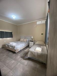 En eller flere senge i et værelse på La cañada