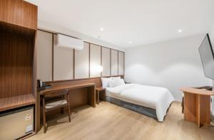Postel nebo postele na pokoji v ubytování Hotel Yam Sangmu