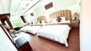 Postel nebo postele na pokoji v ubytování BÔNG SEN HOTEL CÔN ĐẢO