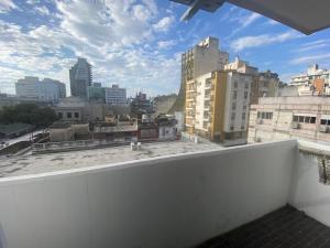 a view of a city skyline from a balcony at Julia Apparts - DEPARTAMENTO CALEFACCIONADO EN EL CENTRO DE LA CIUDAD CON GARAGE APARTE in Córdoba