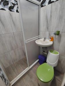 a bathroom with a shower and a toilet and a sink at Refugio Del Mar in Burrero +13 photos