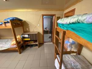 a room with two bunk beds and a hallway at Вилла Толстого in Umanʼ +3 photos