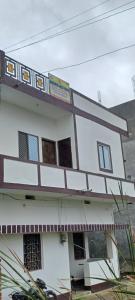 a building with a train on top of it at Dharmik guest house in Bodh Gaya