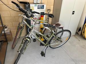 two bikes are parked next to a wall at Myalup Retreat in Binningup