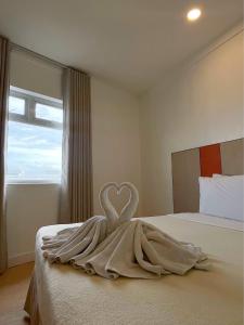 Postel nebo postele na pokoji v ubytování ILOILO GRAND HOTEL