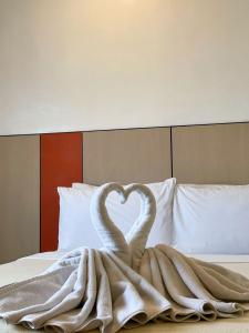 Postel nebo postele na pokoji v ubytování ILOILO GRAND HOTEL