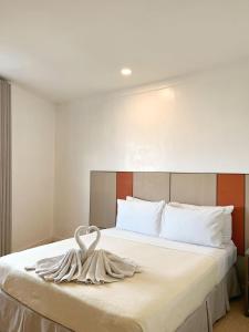 Postel nebo postele na pokoji v ubytování ILOILO GRAND HOTEL