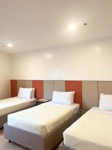 Postel nebo postele na pokoji v ubytování ILOILO GRAND HOTEL