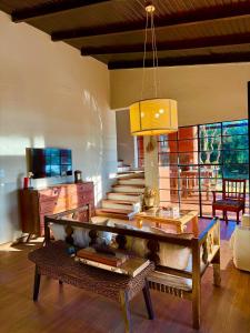 a living room with a couch and a table at LA BRUJA BUENA Casa Boutique in Loreto