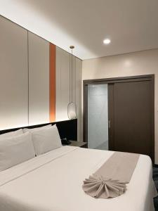 Postel nebo postele na pokoji v ubytování ILOILO GRAND HOTEL