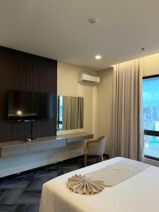 Postel nebo postele na pokoji v ubytování ILOILO GRAND HOTEL