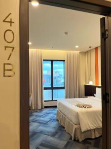 Postel nebo postele na pokoji v ubytování ILOILO GRAND HOTEL