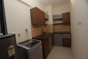 Fotografie z fotogalerie ubytování LAVENDER AiRPORT SUiTE v destinaci Nedumbassery