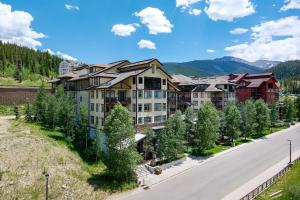 an aerial view of a resort with a road and trees at Fraser Crossing cabin in Winter Park