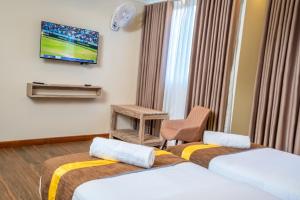 Postel nebo postele na pokoji v ubytování Raj Residencies