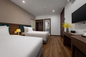 Voodi või voodid majutusasutuse Hanoi Vista Hotel toas