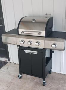 a barbecue grill sitting on top of a table at The Reel Freedom Cottage at Leesville Lake in Carrollton