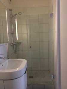 a bathroom with a shower with a toilet and a sink at Studio sur cour au coeur de Colmar in Colmar