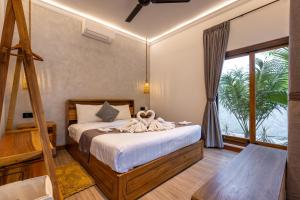 Postel nebo postele na pokoji v ubytování Nomada Villas + 37 fotografií