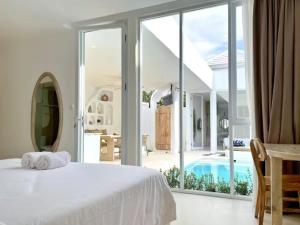 Ένα ή περισσότερα κρεβάτια σε δωμάτιο στο VON Hideaway Villa by Maheswara +42 φωτογραφίες