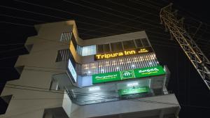 a building with a tijuana inn sign on top of it at Tripura Inn in Nalgonda