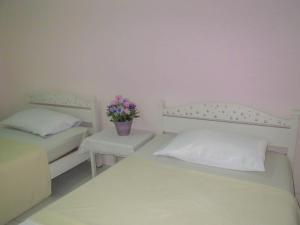 Postel nebo postele na pokoji v ubytování Chomdao Hotel