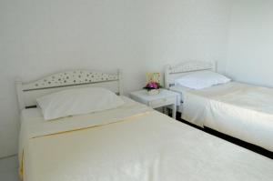 Cama ou camas em um quarto em Chomdao Hotel