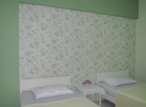 Postel nebo postele na pokoji v ubytování Chomdao Hotel